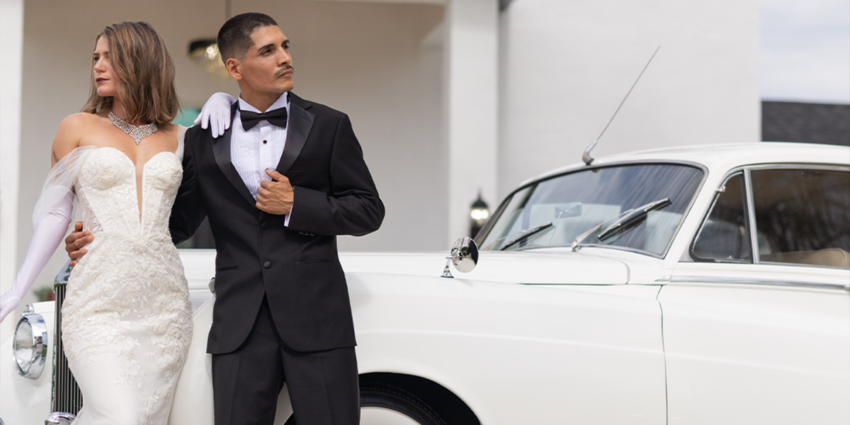 Bride and groom in 1920s era styling beside the vintage 1960 Rolls Royce Silver Cloud II at the Sip Social styled shoot at Rock Manor in Naples Florida