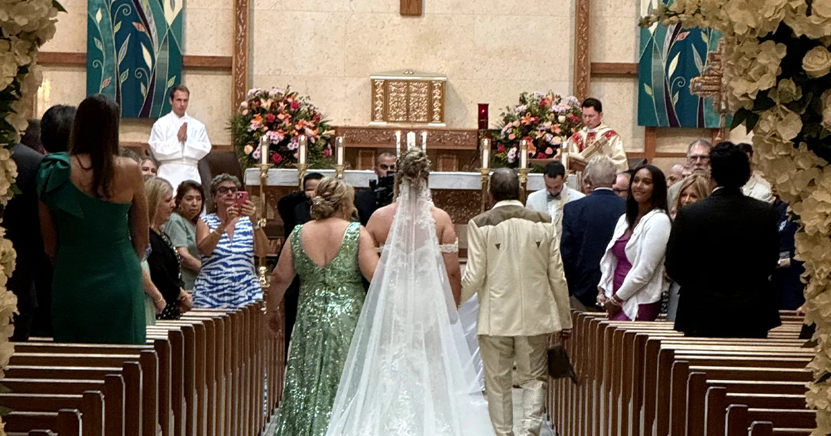 Morelli Wedding Ceremony Aisle St. Leo the Great Bonita Springs FL Bride walking down the aisle at St. Leo the Great Catholic Church in Bonita Springs Florida during the Morelli wedding ceremony