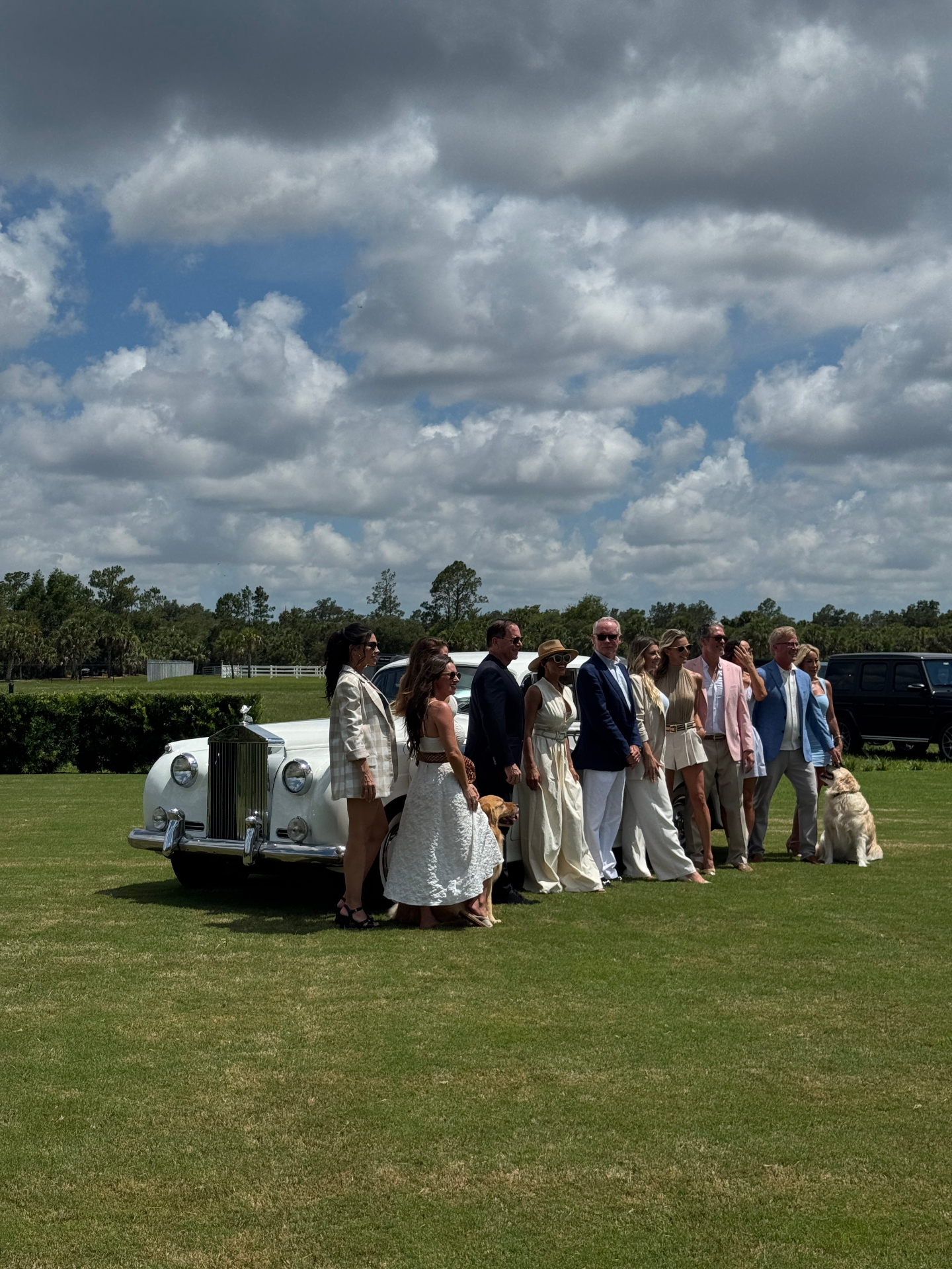 Shore Acres Farm Wedding — Naples, FL Wedding guests gathered beside a vintage white Rolls-Royce Silver Cloud II on the open pasture at Shore Acres Farm in Naples, Florida