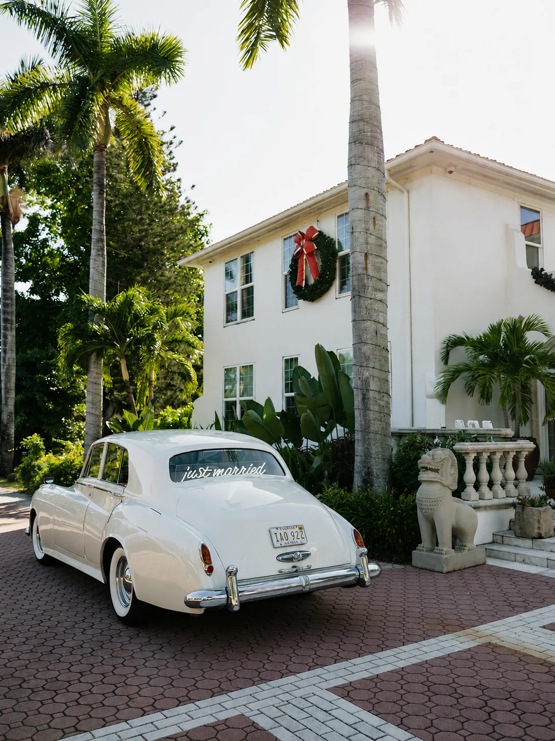Shangri-La Springs wedding — vintage 1960 Rolls-Royce Silver Cloud II with 'just married' script at the Bonita Springs venue