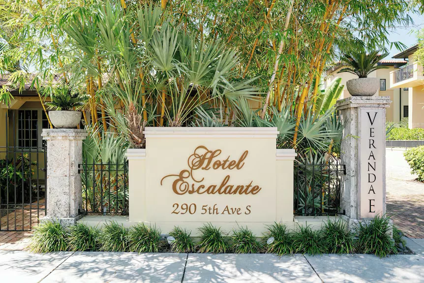 The Escalante wedding venue — boutique hotel courtyard with tropical gardens, elegant architecture, and romantic outdoor ceremony space in Naples, Florida