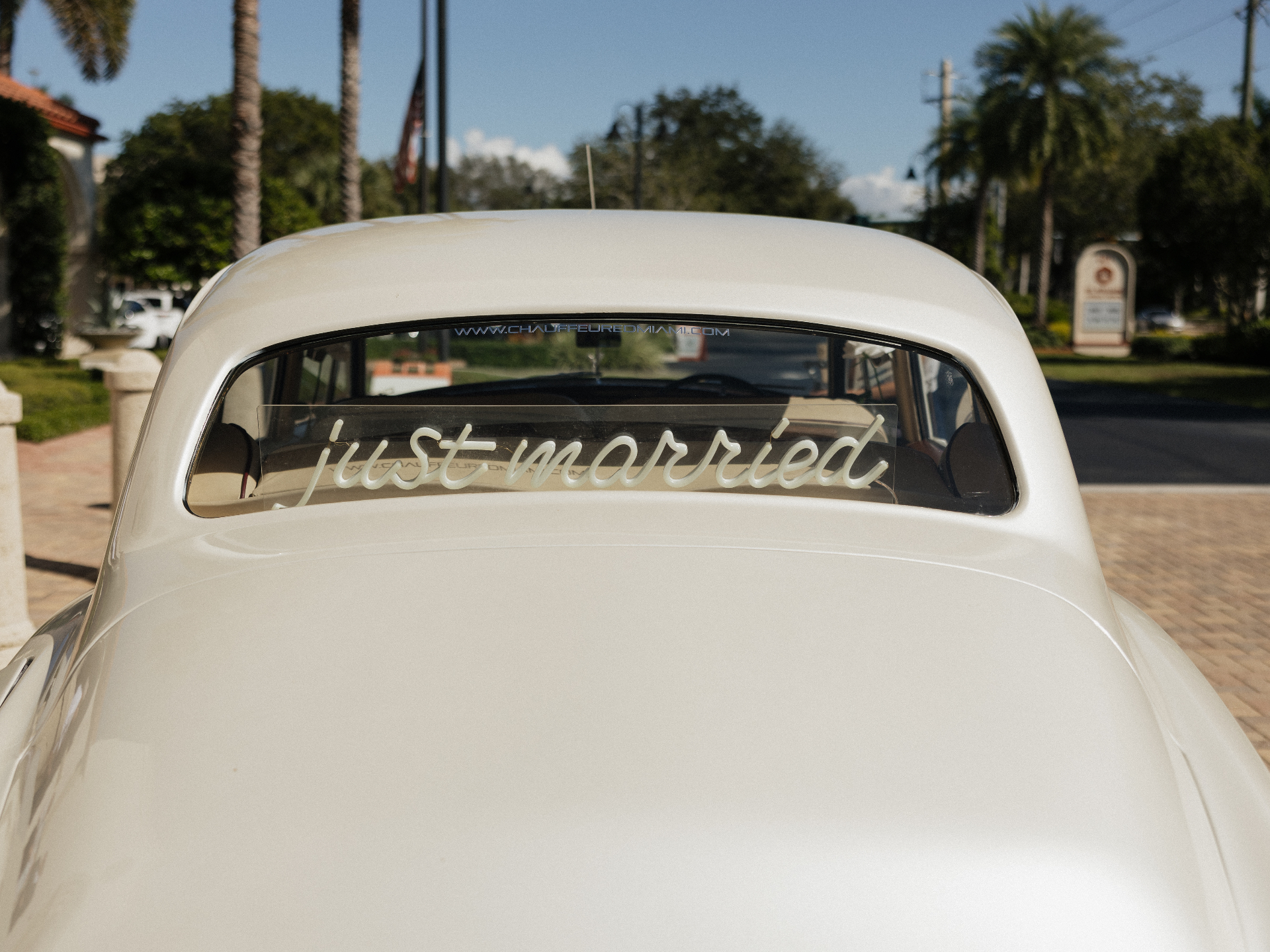 Rear view of vintage Rolls-Royce Silver Cloud with just married sign at Naples Florida wedding